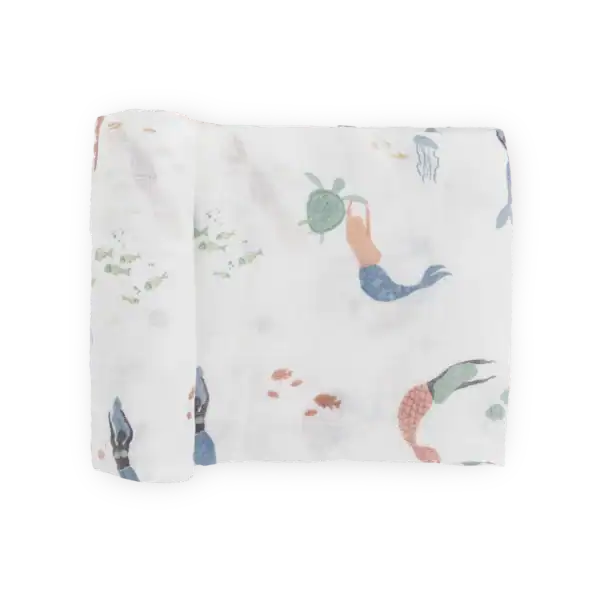 Rolled white fabric with colorful mermaid design