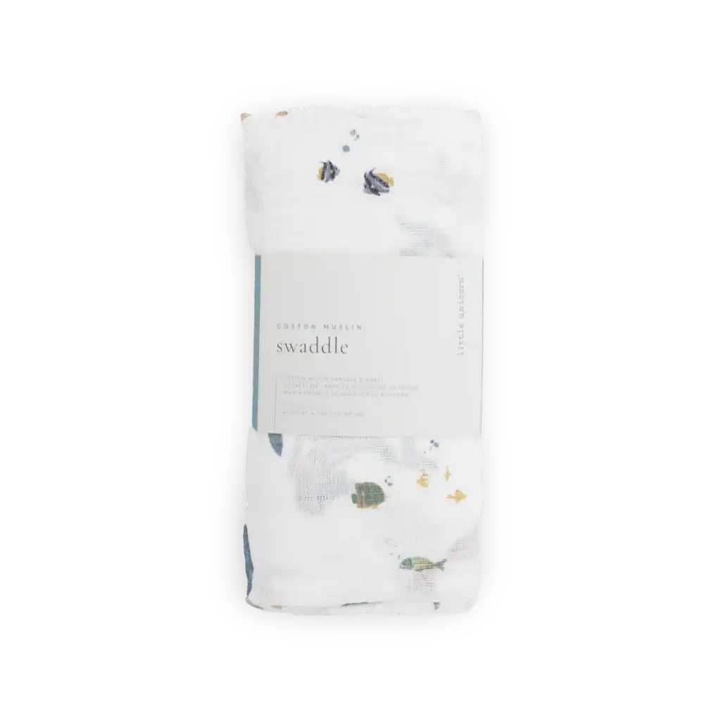 Cotton muslin swaddle with aquatic theme.
