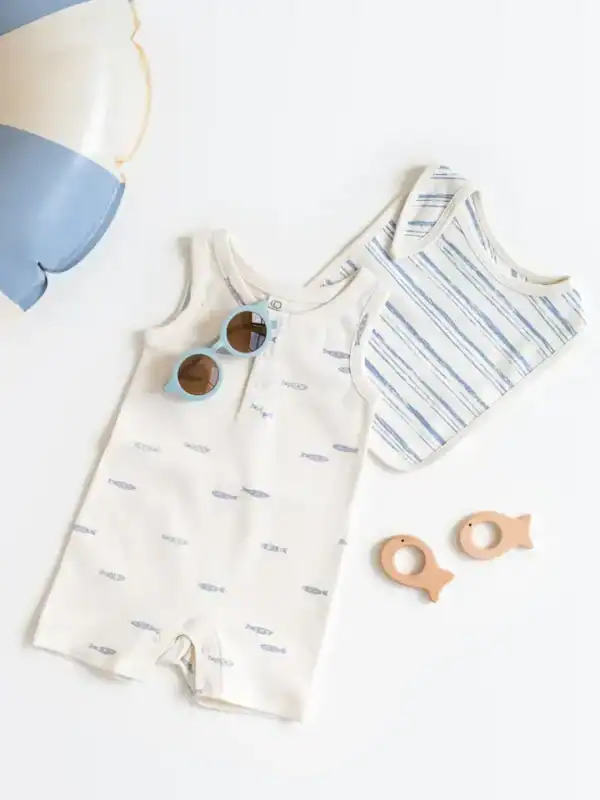 Baby romper and accessories with beach theme.