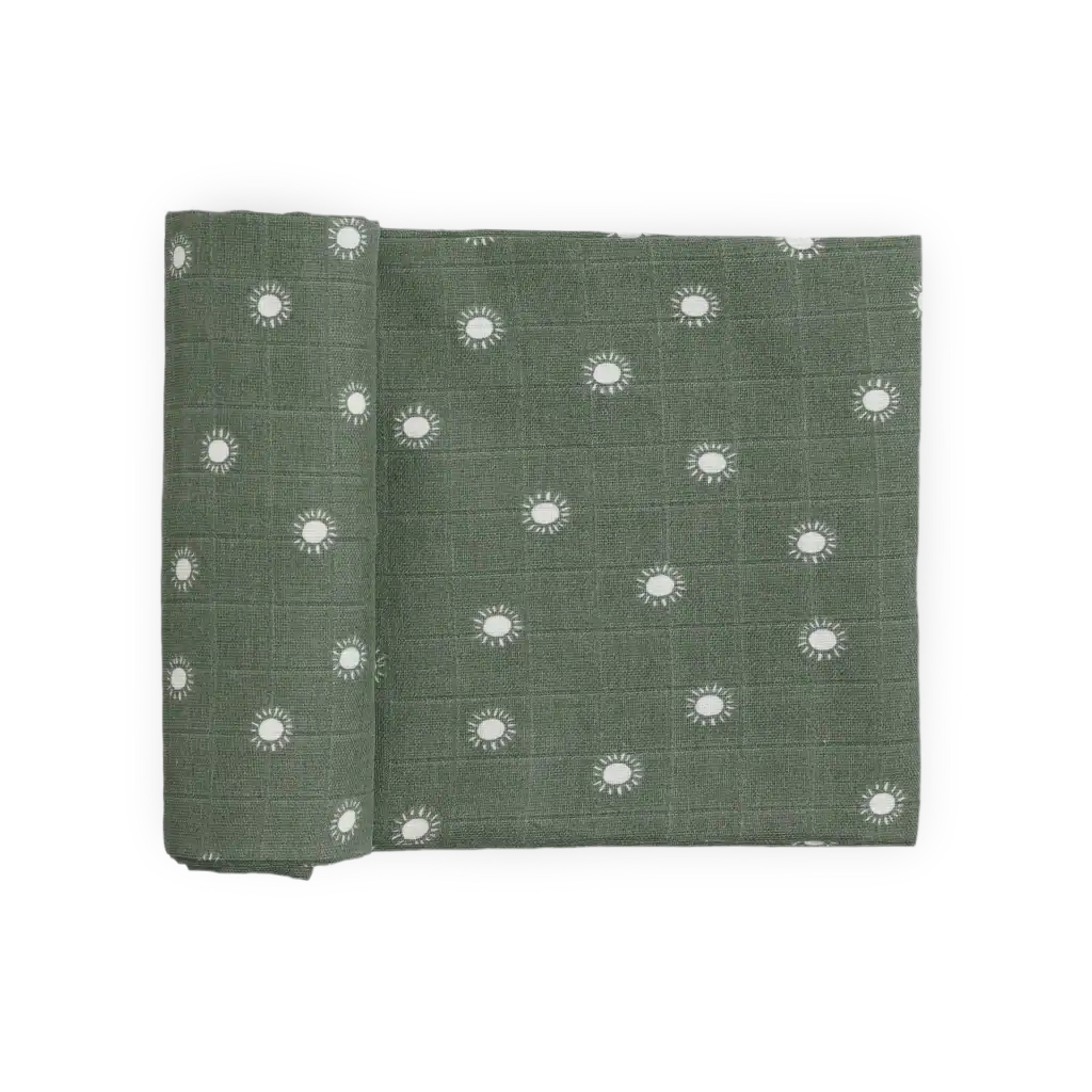 Green fabric with white sun patterns.