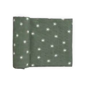 Green fabric with white sun patterns.