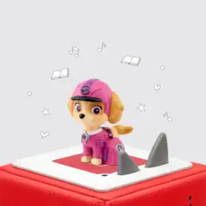 Pink dog toy on red speaker box.