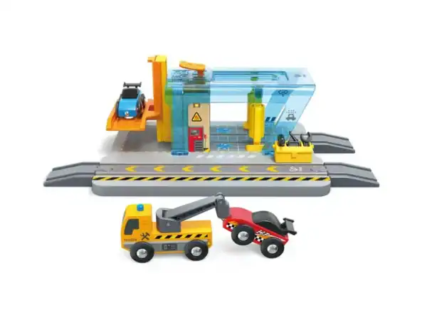 Toy car garage set with vehicles and tracks.