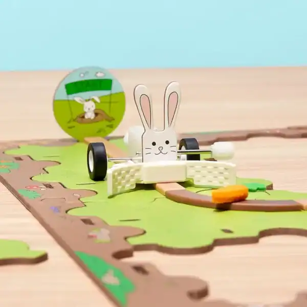 Toy bunny car on racetrack board game