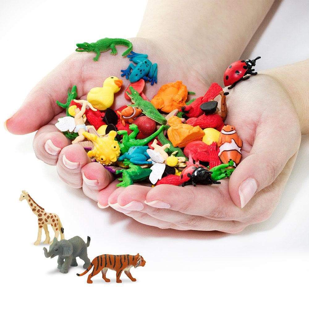 Colorful toy animals in hands.