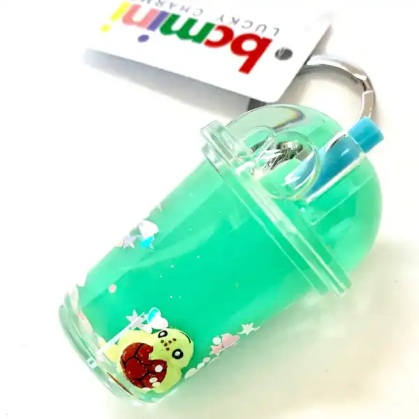 Green drink keychain with cartoon turtle design.
