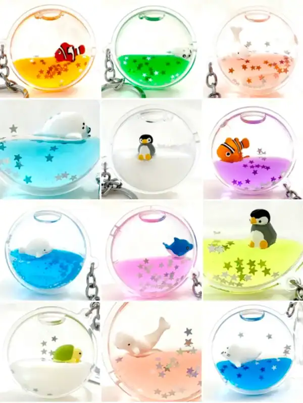 Colorful liquid-filled animal keychains with stars.