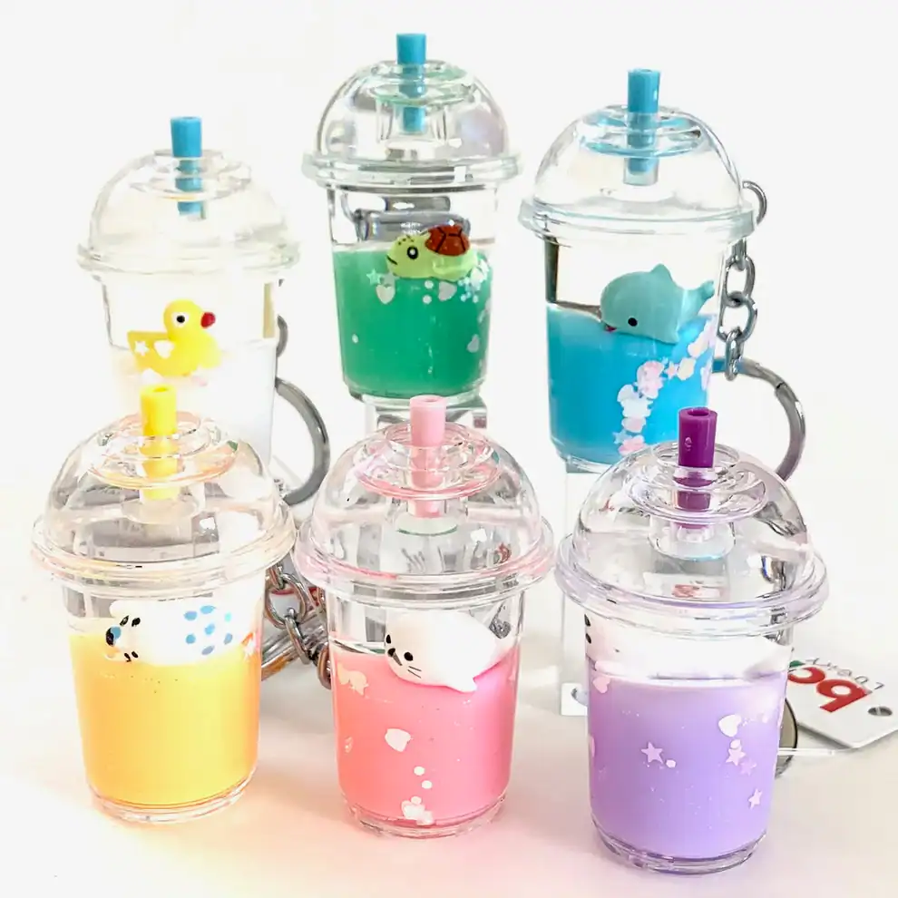 Colorful animal keychains in cup design.