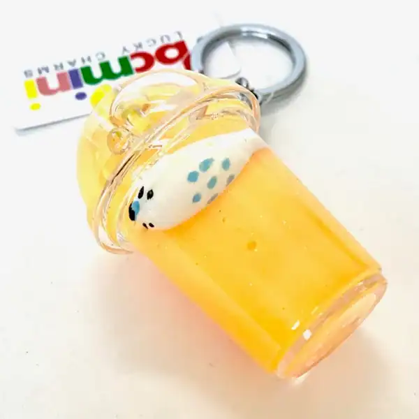 Orange drink keychain with whipped cream topping