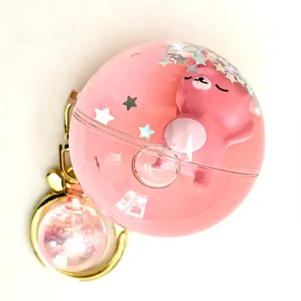 Pink bear keychain with star glitter inside.