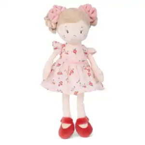 Plush doll in floral dress with red shoes.