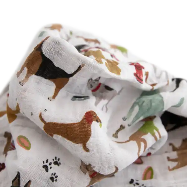White fabric with colorful dog illustrations.