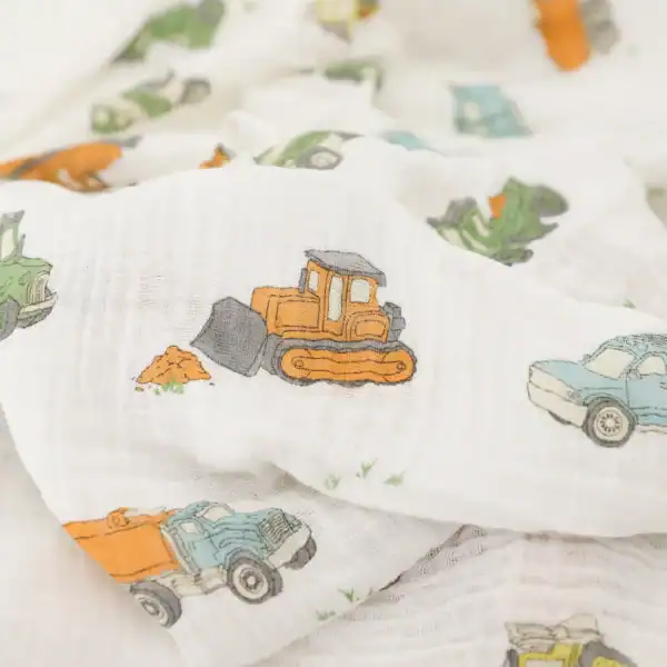 Muslin cloth with colorful trucks and tractors print.