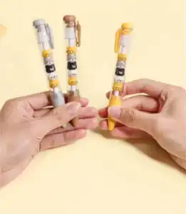 Cute animal pens held in hands