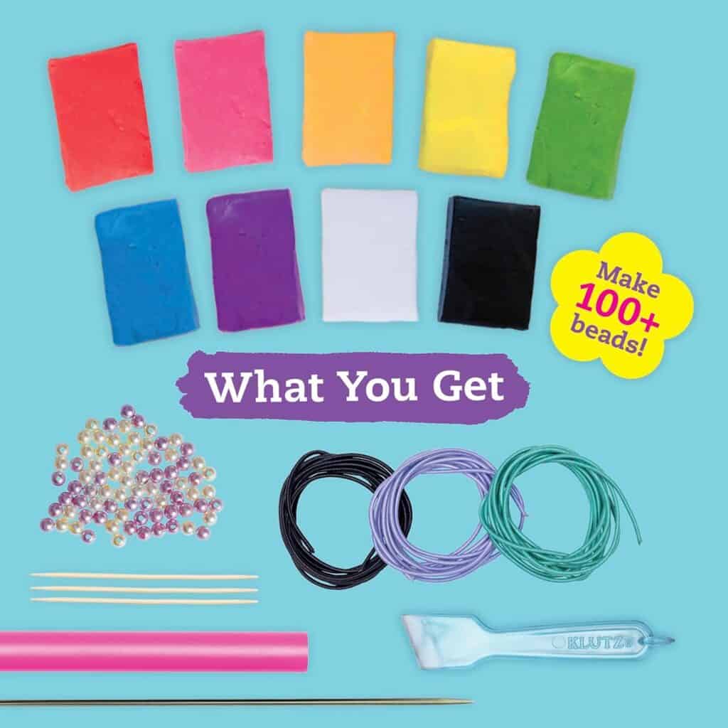 Clay, beads, wires, and tools for bead making.