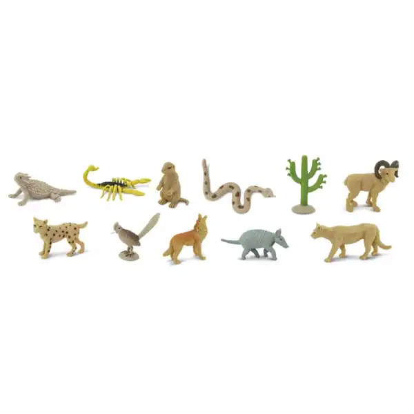 Toy desert animals and cactus figures arrangement.