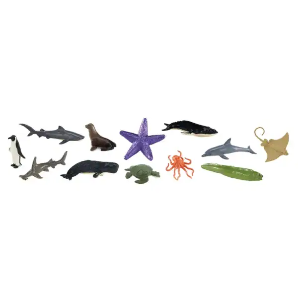 Assorted sea animal figurines on white background.