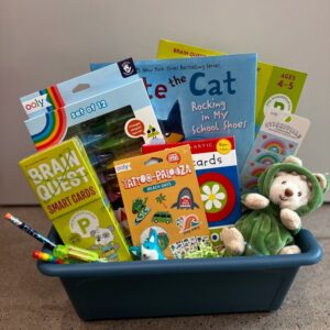 Children's gift basket with books and toys.