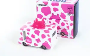 Pink cow-pattern toy truck with packaging.