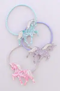 Colorful unicorn glitter hair ties on display