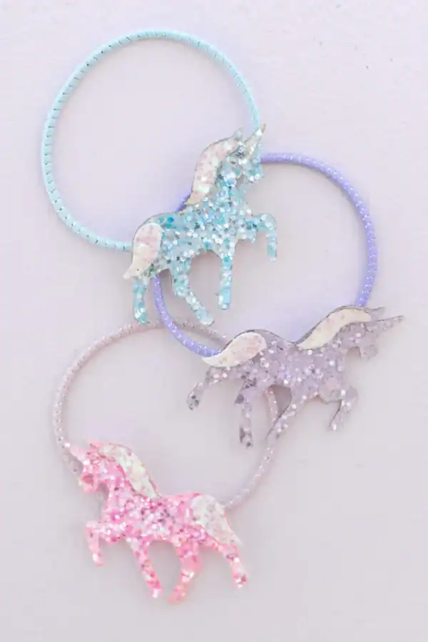 Colorful unicorn glitter hair ties on display