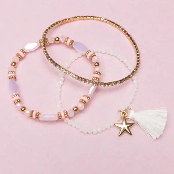 Three pastel bracelets on pink background