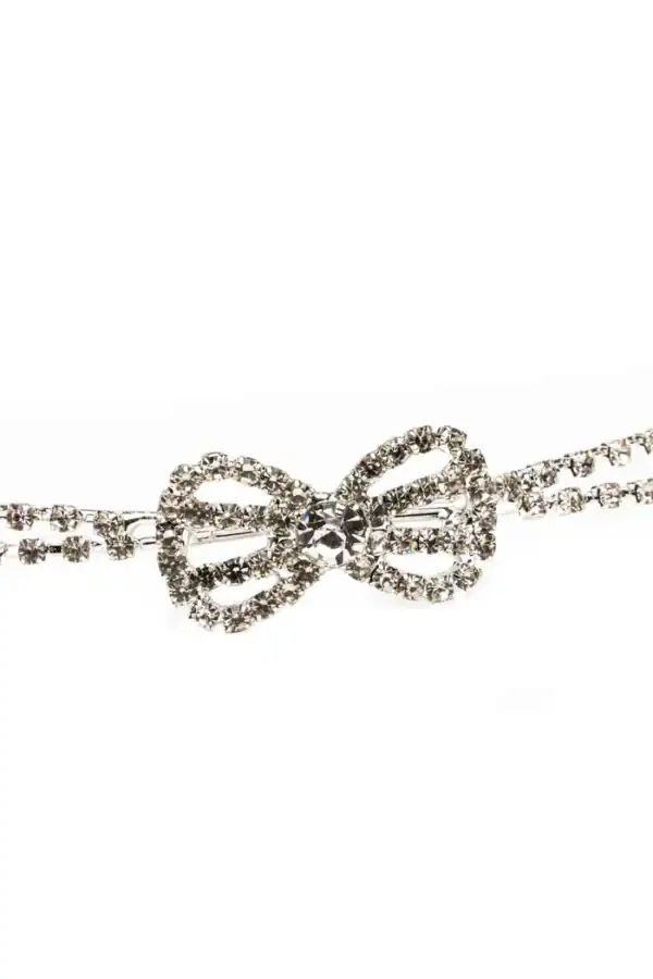 Sparkling rhinestone bow bracelet on white background.
