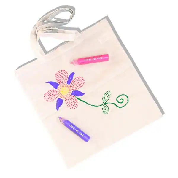 Canvas bag with colorful flower design and markers.
