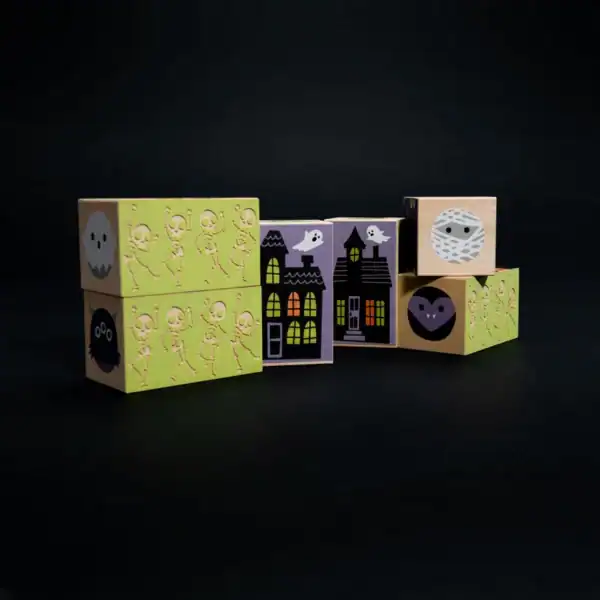 Halloween-themed wooden blocks with skeletons and ghosts.