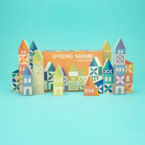 Colorful building blocks set on blue background.