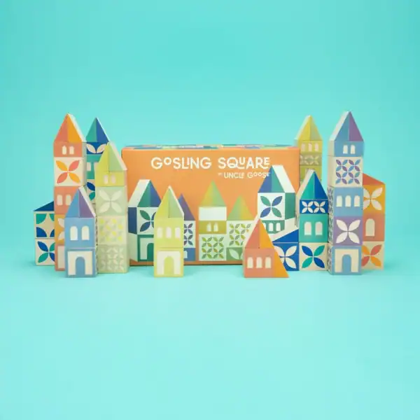 Colorful building blocks set on blue background.
