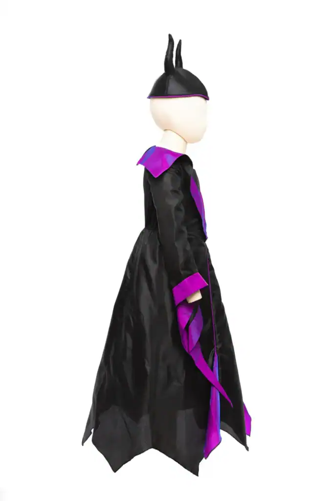 Child mannequin in black and purple costume