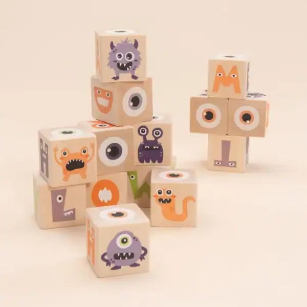 Wooden blocks with colorful monster illustrations.