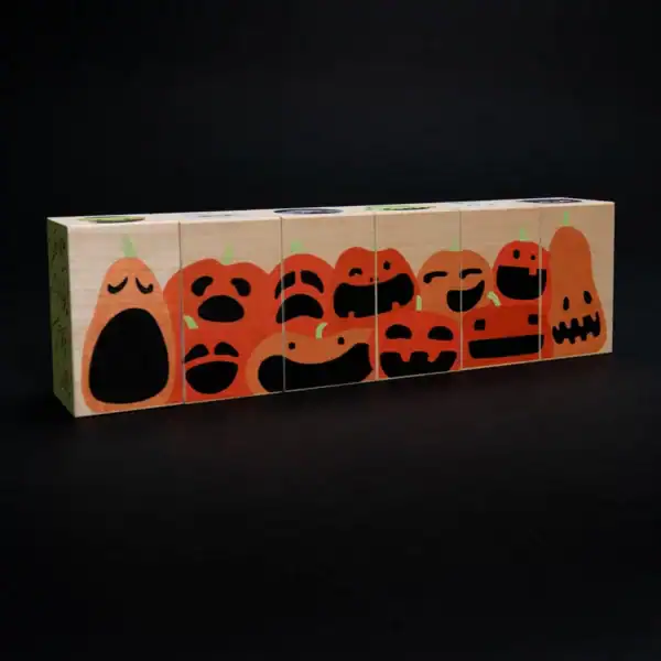 Wooden blocks with Halloween pumpkin faces