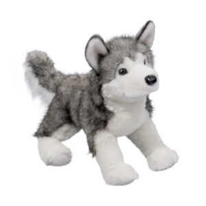 Gray and white plush husky toy on white background.