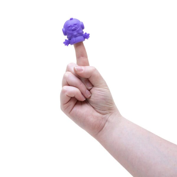Hand with purple robot finger puppet.