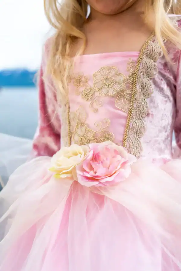 Child in pink dress with floral details
