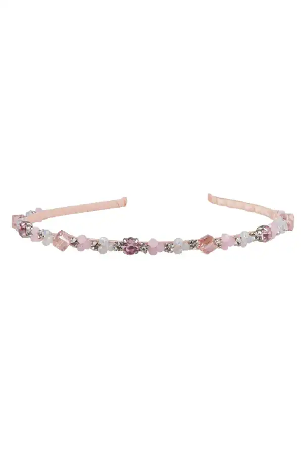 Pink gemstone beaded headband on white background.