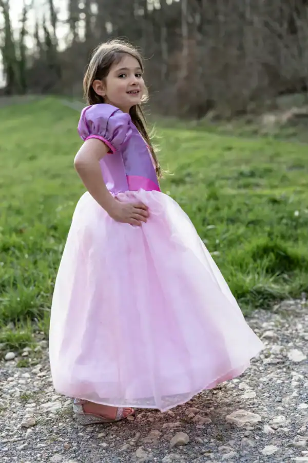 Girl wearing princess dress outdoors