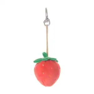 Plush strawberry keychain with green leaves.