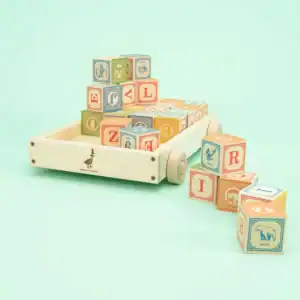 Wooden cart with colorful alphabet blocks.