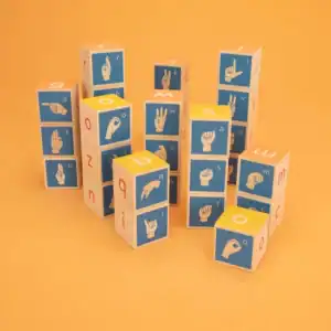 Alphabet blocks with sign language illustrations.