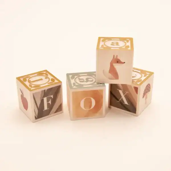 Wooden blocks spelling 'FOX' with fox illustration.