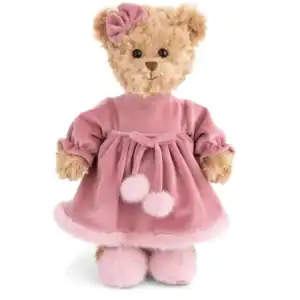 Plush teddy bear in pink dress and bow.