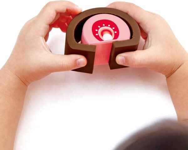 Child holding anatomy model of the ear