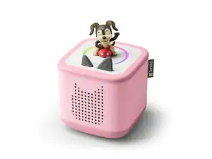 Pink Toniebox with dog figurine on top.