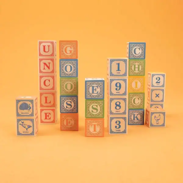 Colorful alphabet and number blocks on orange background.