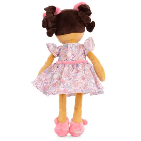 Plush doll in floral dress with curly hair