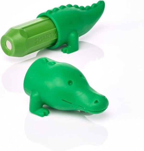Green crocodile-shaped crayon holder on white background.