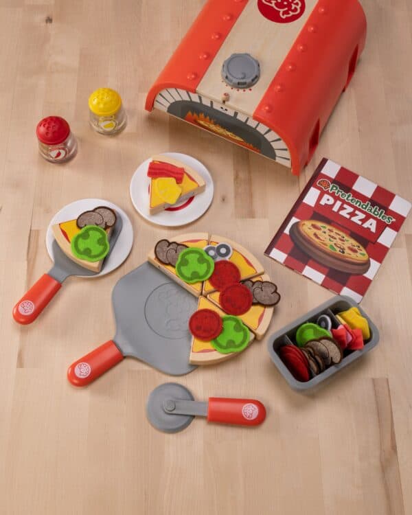 Toy pizza set with toppings and oven.